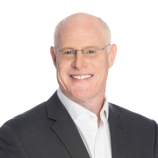 Brian Hannifin in black suit with white shirt and glasses