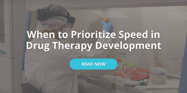 "When to prioritize speed in drug therapy development" with a "read now" button over a greyed-out ijmage of a gowned man working in a clean room and holding a flask.